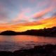 A beautiful colourful view of a sunset over Shelley Beach in Sydney.